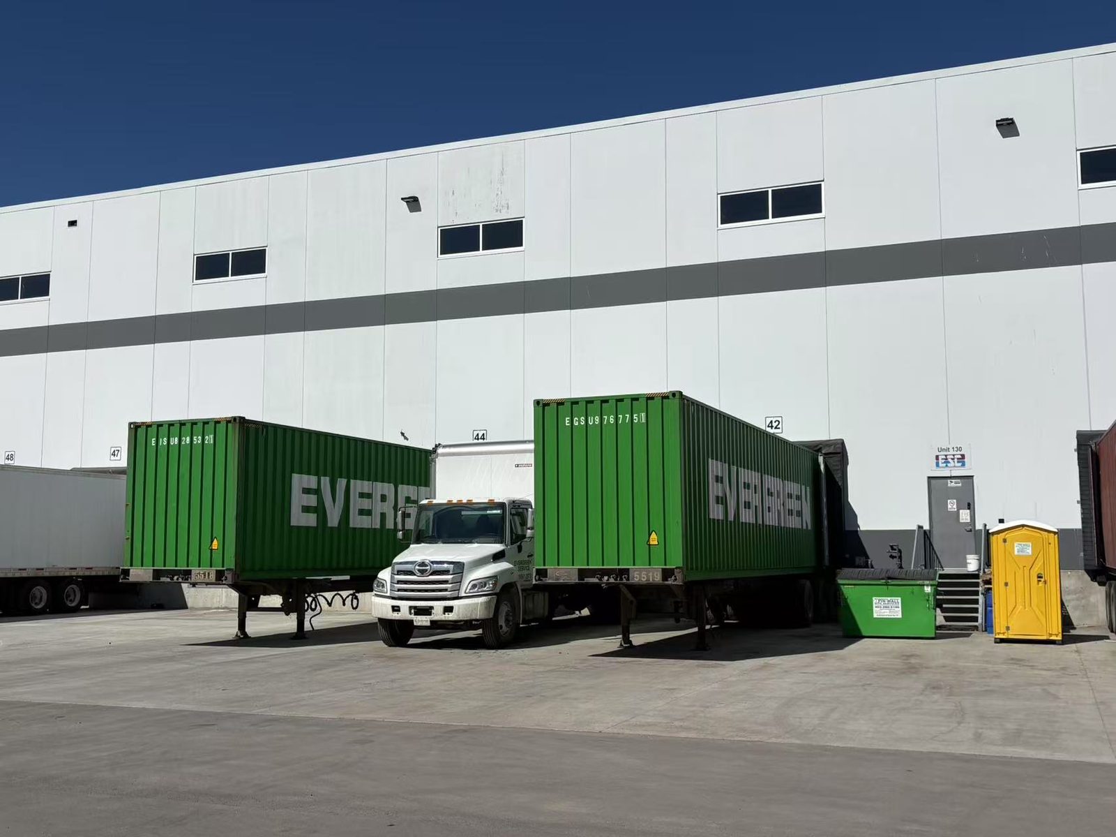 EVERGREEN containers and truck